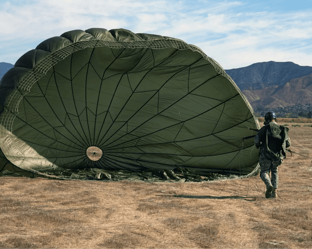 Military operator with tactical parachute