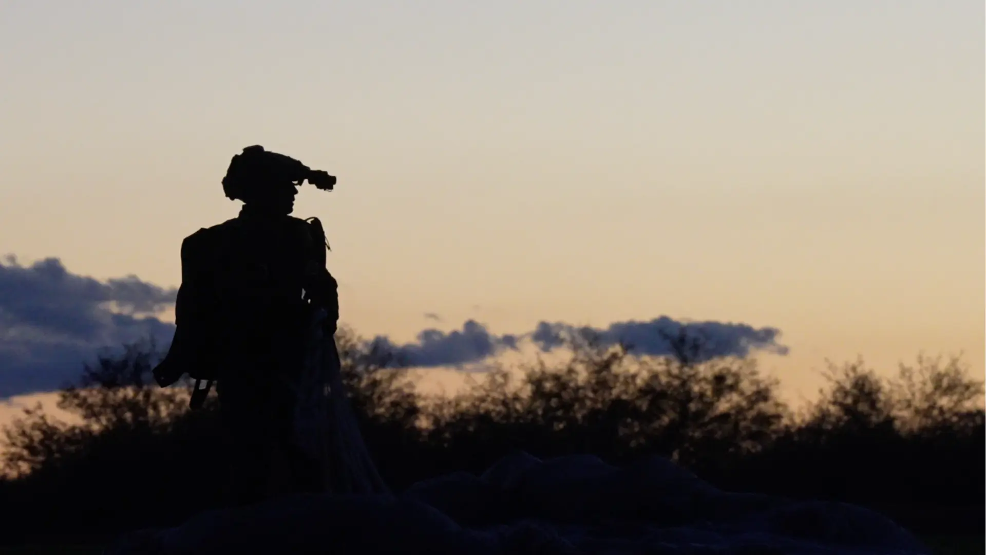 Military operator at sunrise